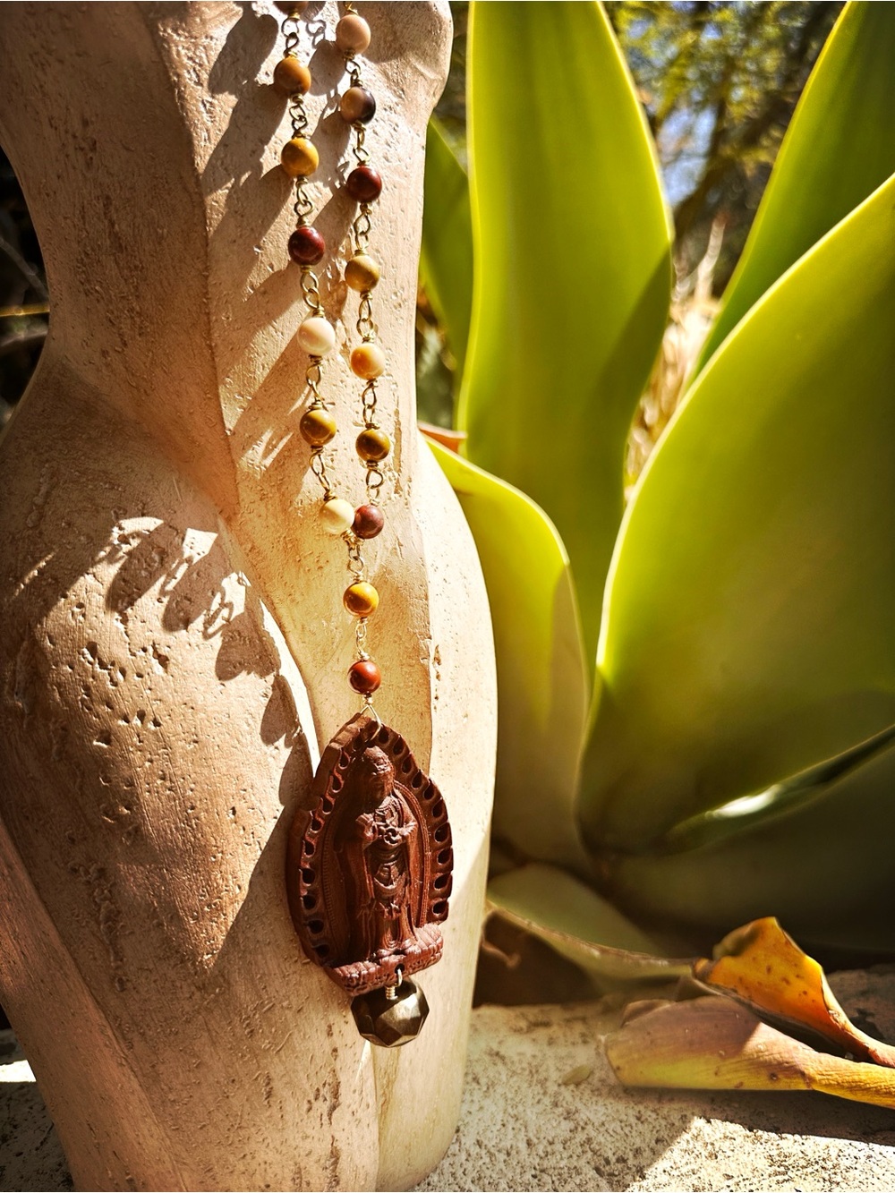 Wood Goddess carved pendant on unakite beads.